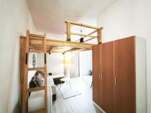 a room with a bunk bed and a desk at Apartmani Vukovic in Budva