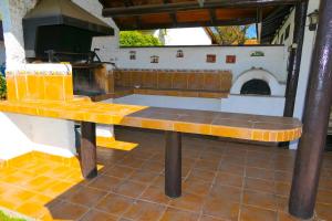 a bench in a kitchen with a pizza oven at Lake Rapel, beautiful lake view in Las Cabras
