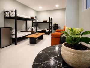 a living room with two bunk beds and a table at Hotel Boutique Venecia Cdmx in Mexico City