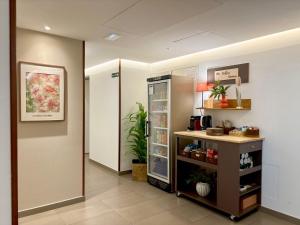 a room with a refrigerator and a shelf with food at Hotel BESTPRICE Gracia in Barcelona