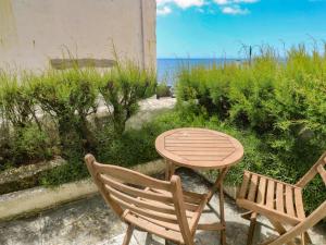 a table and two chairs and a table and a table and chairs at Pegs in Porthleven