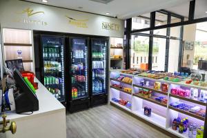 a store with two refrigerators in a store at Ninety Hotel in São Paulo