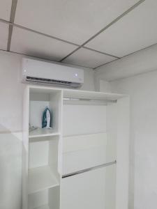 a room with white walls and a ceiling at Hospedaje céntrico in Zacatecoluca +9 photos
