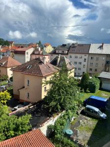 a view of a city with buildings and a car at Máneska in Cheb