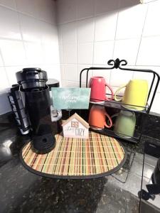 a coffee maker on a table in a kitchen at Cozy Getaway in Orlando