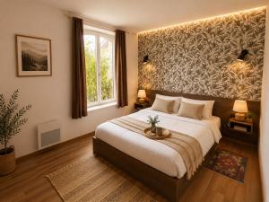 a bedroom with a large bed and a window at Au Bon Gîte in Senones