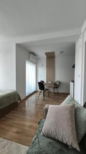 a living room with a couch and a table at DIV Apartman in Vrnjci
