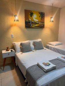 two beds in a room with two lamps at Pousada Marúa Fortaleza in Fortaleza +102 photos