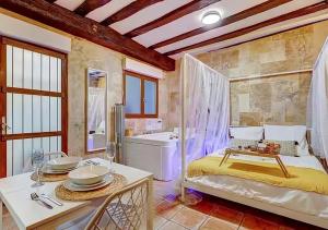 a bathroom with a bed and a tub and a sink at Bed & Spa - La Parenthese in Dijon +6 photos