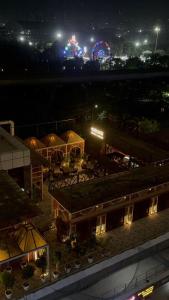 a night view of a fair with tents and a carnival at Glow Corner in Greater Noida +6 photos