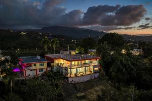 an aerial view of a house at night at 2 Ocean View Villas with Private Pool in Luquillo