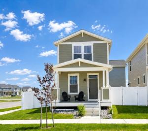a house with a white fence in front of it at Walkable to Parks, Yellowstone River, Coffee Shop in Billings