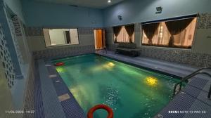 a swimming pool with a red frisbee in it at شاليه سما in Taif