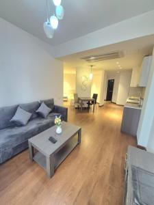 a living room with a couch and a table at Appartament Buzanda 17 in Yerevan