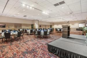 a banquet hall with tables and chairs and a podium at Best Western Plus Coeur d'Alene Inn in Coeur d'Alene +63 photos