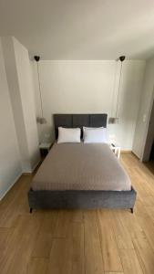 a bedroom with a bed with two pillows on it at Se Soul in Asprovalta +51 photos