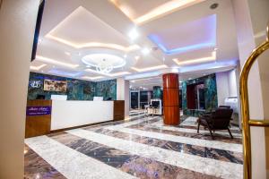 an office with a lobby with a reception desk at Swisse International Rancho Valeria Hotel & Suites in Warri +51 photos