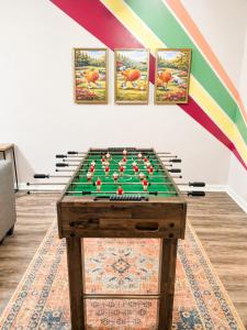a pool table in a room with a rainbow at luxury condo, pet friendly, close to everything in Augusta