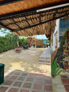 a building with a painting on the side of it at Cabañas Sol y Mar in San Antero