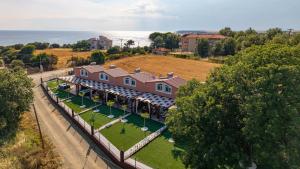 an aerial view of a house with a yard at En Sophia Guesthouse in Maronia