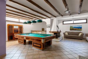 a large room with a pool table in it at Villa Cielo in Paceco
