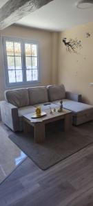 a living room with a couch and a coffee table at O casal in Cambados