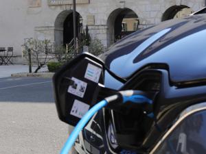 a close up of a parking meter with a car at Hotel De Bourbon Grand Hotel Mercure Bourges in Bourges