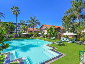 an image of a swimming pool at a resort at Mercure Hotel Nelspruit in Nelspruit