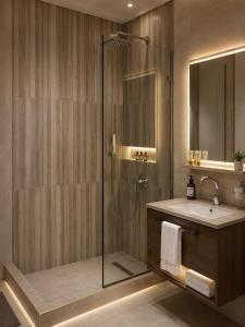 a bathroom with a shower and a sink at Pyra King Royal Pyramids Hotel in Cairo +23 photos