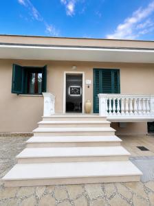 a house with stairs in front of it at B&B Clav's Home - bebclavshome in Pozzilli