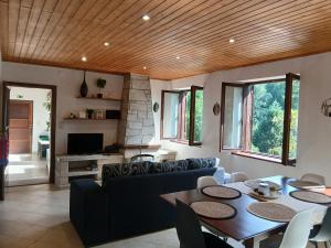 a living room with a couch and a table at Gerês by Papitravel in Vieira do Minho