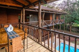 an outdoor deck of a house with a pool at 56 Crocodile in Komatipoort