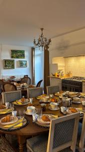 a dining room table with food on top of it at L'échappée belle in Sixt-sur-Aff