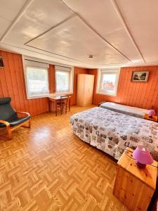a bedroom with a bed and a table and chairs at Gites des Gentianes in Morbier +49 photos