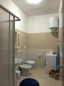 a bathroom with a toilet and a sink at IL PARADISO DEGLI DEI 2 in Agerola
