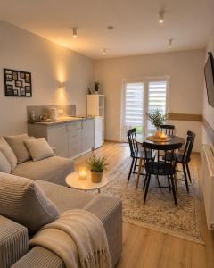 a living room with a couch and a table at V36 Apartments in Palanga