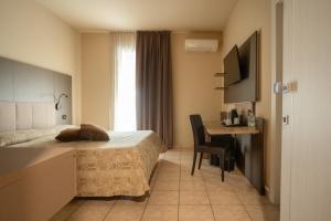 Postelja oz. postelje v sobi nastanitve Hotel Campanello