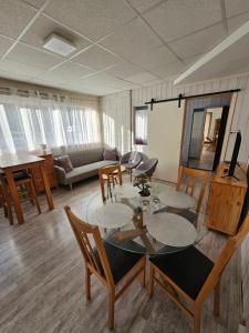 a living room with a table and chairs at Leilighet 6 in Dalen