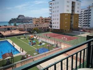 a view from a balcony of a city with a pool at Peñiscola Playa FRENTE AL MAR in Peniscola