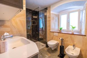 a bathroom with a sink and a toilet at Ferienwohnung Mamma Rosa 1 in Wunsiedel +51 photos