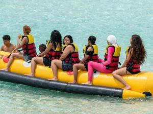 a group of people sitting on a raft in the water at Remas resort in El Alamein