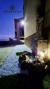 a building with a rock pathway in front of a building at Sharazan in Canicattì