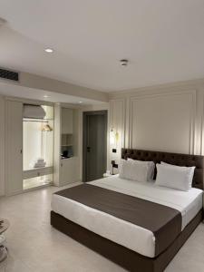 a large bedroom with a large bed in a room at DriArt Center in Tirana