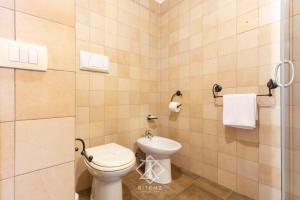 a bathroom with a toilet and a sink at Dimora Cala-Vista in Torre Dei Corsari +44 photos