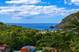 a view of the ocean from a resort at Blue Sky Apartment in Soufrière
