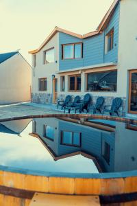 a house with a swimming pool in front of a house at Black Hills Caviahue in Caviahue