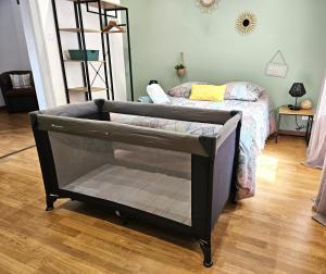 a small bed in a room with a bedroom at Cosy room - centre ville - 2 pers in Sarreguemines