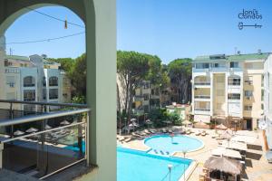 a view of the pool from a balcony of a hotel at Joni's Small Condo in Golem