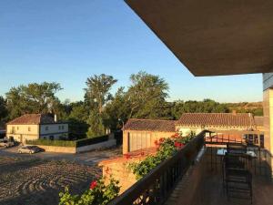 a view from a balcony of a house with flowers at Casa Zacarias - Bonitas vistas en La Rioja in Herramélluri