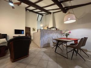 a dining room with a table and some chairs at A Casita do Ferreiro in Sober